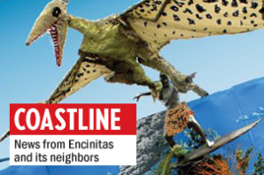A page from the 2013 Cardiff Kook Calendar shows a papier mache pterodactyl grabbing onto the "Magic Carpet Ride" statue in Cardiff. (Photo courtesy of Fred Caldwell)