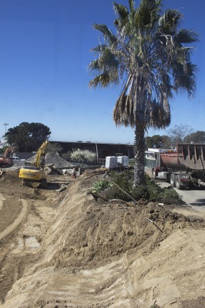 Crews work on the site of San Dieguito High School Academy's future math and science complex, pictured through a wall portal Feb. 11. (North Coast Current photo)