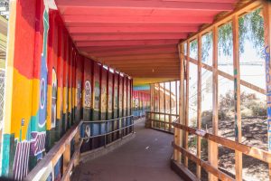 Over the past year, students have created murals along the wall of what has become known as the "tunnel," a walkway separating construction and safe passage at San Dieguito High School Academy in Encinitas, pictured Sept. 15. (Photo by Jen Acosta)