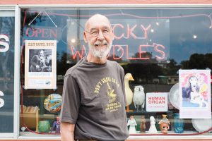 Jerry Waddle stands in front of his Leucadia shop, Ducky Waddles, on May 29, 2015. At the time, Encinitas residents organized a cash mob to help keep the store afloat. (NCC file photo by Jen Acosta)