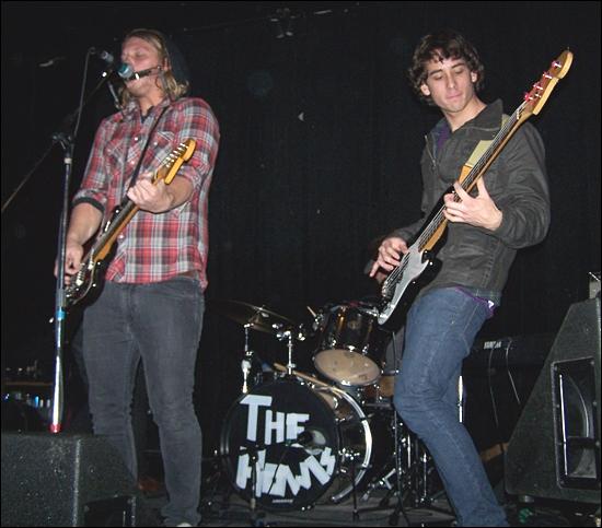 The Howls perform at Kensington Club on Jan. 17. From left: John Cooper, Dave Gargula (on drums, obscured) and Caleb Chial. (Photo by Scott Landheer)