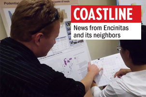 Two residents discuss the benefits of building low-income housing in different locations throughout Encinitas during a General Plan workshop May 14 at the Encinitas Community Center. (Photo by Ernesto Lopez)