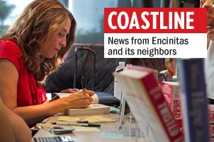 Caitlin Rother signs a copy of “Lost Girls,” her latest book about convicted murderer John Gardner that has stirred  controversy among the families and supporters of victims Amber Dubois and Chelsea King.