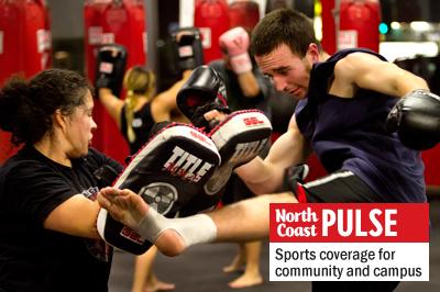 Mitchell Durand lays a hard kick on training pads held by Paola Ramirez during a Muay Thai class at Team Quest Encinitas Xtreme Fitness on Nov. 14. Team Quest holds several classes a day ranging from Brazilian jiu jitsu to boxing. (Photo by Scott Allison)