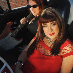 “She plays with such heart and humility,” Candye Kane (below right) says of guitarist Laura Chavez (pictured behind her). (Courtesy photo by Alan Mercer)