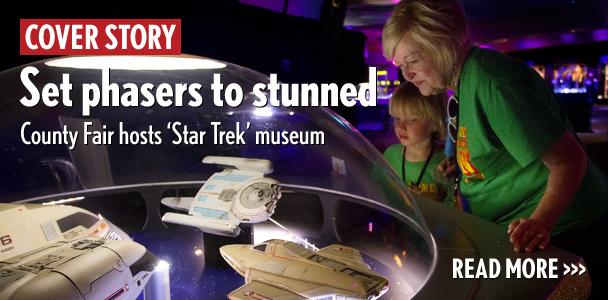 Becky Cox and her grandson, John Peterson, admire the intricate details of “Star Trek” models June 19 used in “The Next Generation” TV series. The ships are part of Star Trek: The Exhibition at the San Diego County Fair. (Photo by Scott Allison)