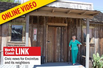 San Dieguito Heritage Museum docent Jan Grice looks out to the museum grounds in mid-September. (Photo by Helen Hawes)