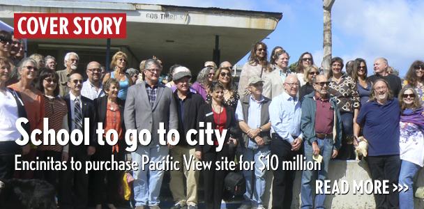 Key supporters pose for a picture March 27 in front of Pacific View school’s entrance. (Photo by Ellen Wright)