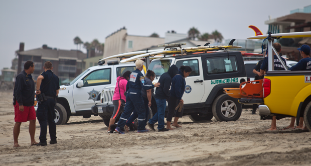 Family members arrive at the scene of where their relative was recovered.