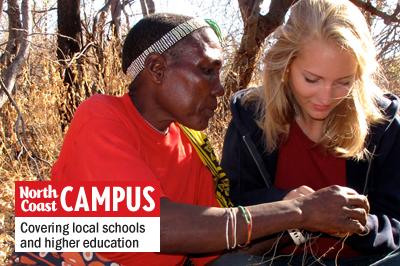 Grauer School student Natalie Brooks (right) works with a tribal member in Tanzania. (Grauer School photo)