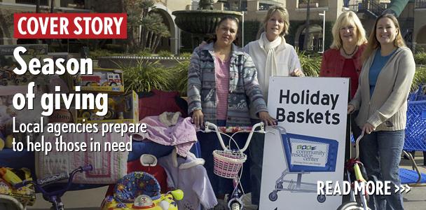 Volunteers help in the Encinitas-based Community Resource Center’s Holiday Baskets drive at the Del Mar Fairgrounds last year. (Community Resource Center photo)