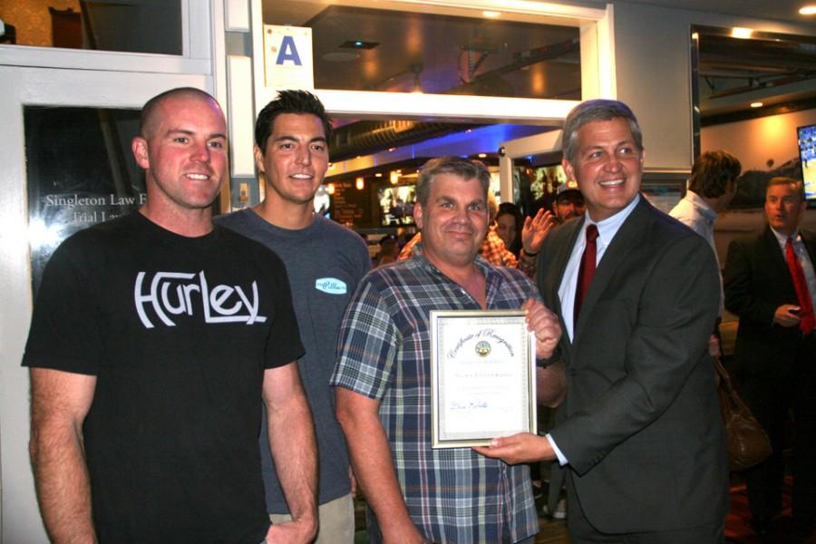Pillbox Tavern & Grill co-owners Justin LaFrantz, Mike Garcia and Leigh Gibson celebrate the eatery’s grand opening Dec. 10 with county Supervisor Dave Roberts (far right). (Photo by Manny Lopez)