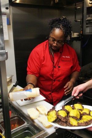 Chef Shelly Velez prepares appetizers during the grand opening of Pillbox Tavern in Solana Beach on Dec. 10. (Photo by Manny Lopez)