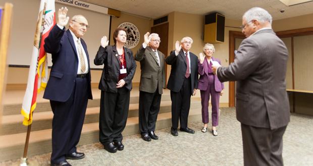 Cyril F. Kellett, Laura Mitchell, Jim Dagostino, Larry W. Schallock and Ramona B. Finnila being sworn in by California Assembly member, Rocky Chavez