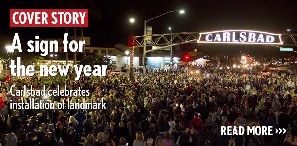 Hundreds of spectators cheer Jan. 8 as the Carlsbad archway sign is lit for the first time at its new home at the corner of Carlsbad Boulevard and Carlsbad Village Drive. (Photo by Scott Allison)