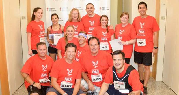 Members+of+the+Falck+team%2C+with+Managing+Director+Mark+Norman+at+front+center%2C+celebrate+the+end+of+a+successful+Climb.%28courtesy+photo%29