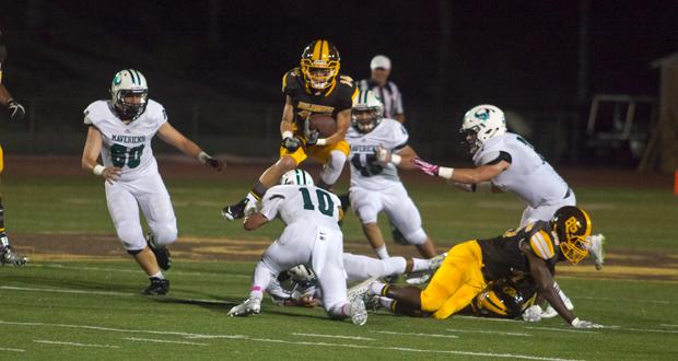 John Armentrout leaps over La Costa defenders