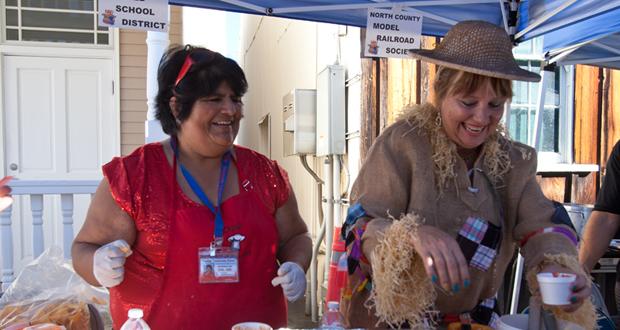 Denise A. Acuna and Pamela Lambert, director of Nutrition Services at OUSD dish up the “Lunch Lady Chili” at the 2014 Fall Festival