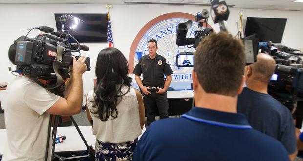 Oceanside Police Officer takes questions from reporters. 