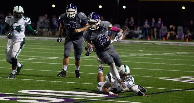 Layth Haddad (15) runs over Niko Mageo(26) in Carlsbads win over Oceanside