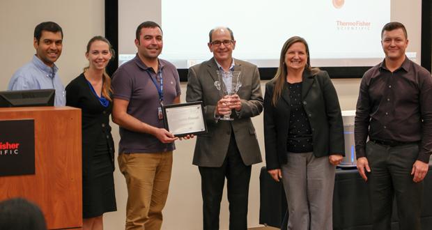 Dr Prussak (center) with lab assistants at ceremony. (courtesy photo)