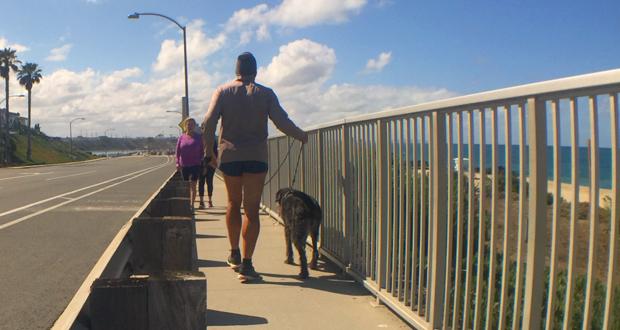 Pedestrians walk along Tamarack Surf Beach in Carlsbad. (OsideNews file photo courtesy: City of Carlsbad)