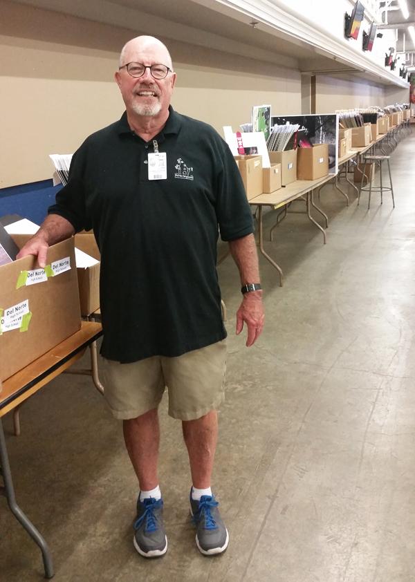 San Diego County Fair Student Showcase Coordinator Neil Bruington stands among hundreds of entries July 6 as the fair season closes at the venue in Del Mar. Bruington is retiring this summer. (Photo by Michele Leivas)