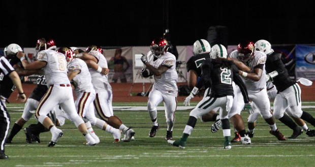 The+Mission+Hills+offensive+line+opens+up+a+hole+for+Grizzly+running-back+Samuel+Dixon