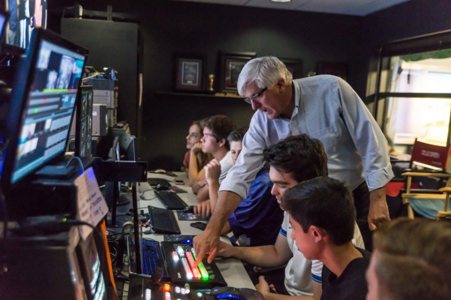 CHSTV adviser Doug Green instructs students before a live broadcast on Oct. 13 at Carlsbad High School. (Photo by Troy Orem)