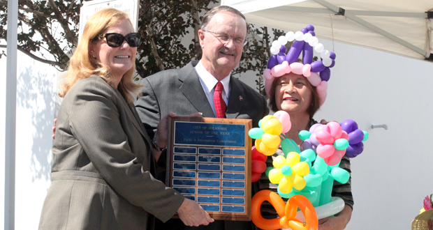 Oceanside City Manager Michelle Skaggs-Lawrence, Mayor Jim Wood and last years Senior Citizen of the Year, Silvia Spiva