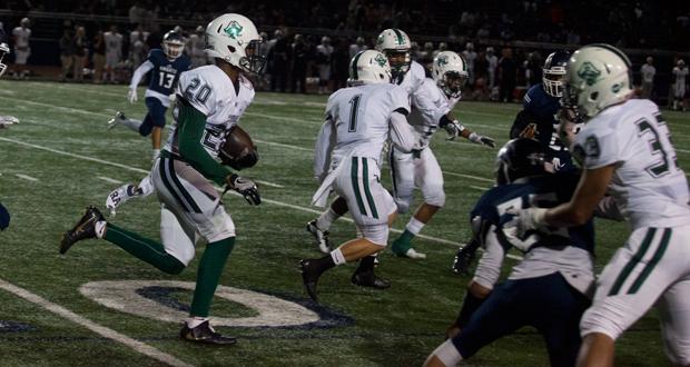 Azizi Hearn(20) resturns an interception against San Marcos earlier this year