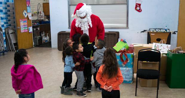 Kids at Balderama Community Center Get an Early Visit from Santa