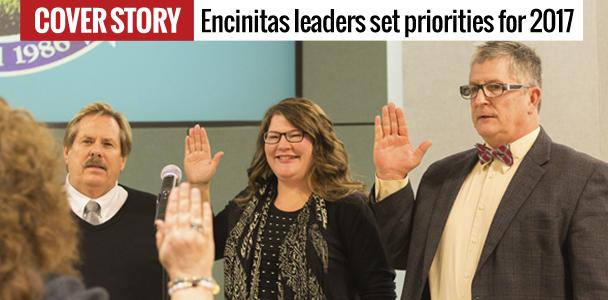 Encintas City Council members Mark Muir (left), Tasha Boerner Horvath and Tony Kranz are sworn in by City Clerk Kathy Hollywood on Dec. 13. (Photo by Cam Buker)