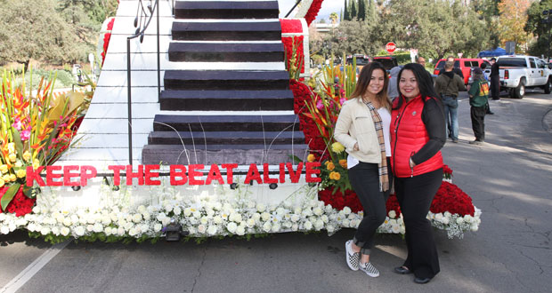 Oceanside resident Celine Showman, CPR survivor and float rider, with her daughter Megan stands in front of the Keep the Beat Alive float presented by Union Bank and the American Heart Association (AHA).  -Courtesy photo.