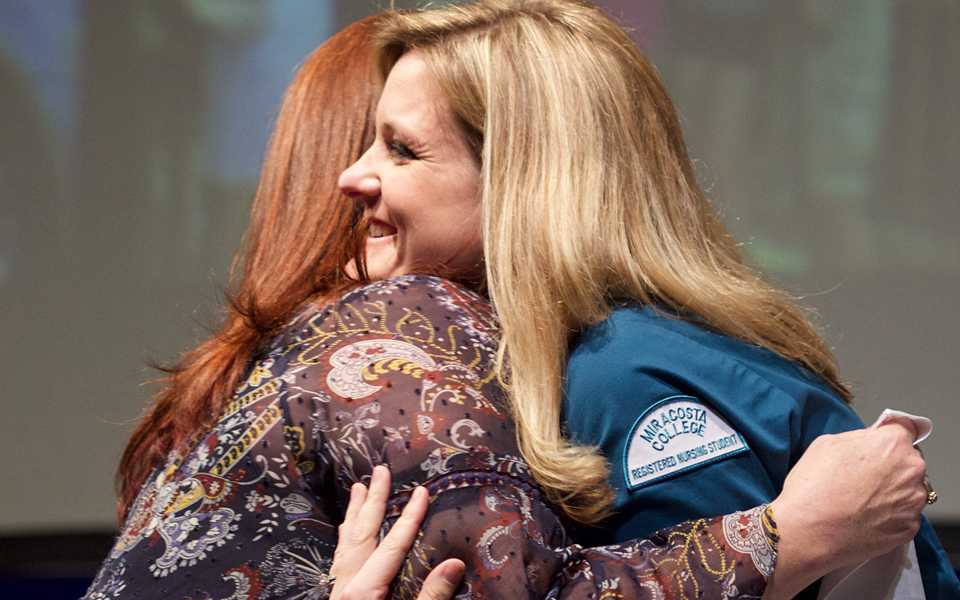 A MiraCosta College nursing student is congratulated Dec. 15 during the program's fall semester pinning ceremony. (MiraCosta College photo by Tanner McQueen)