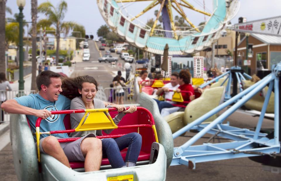 Visitors enjoy a ride at the Encinitas Spring Street Festival on April 28, 2013. (NCC file photo by Scott Allison)