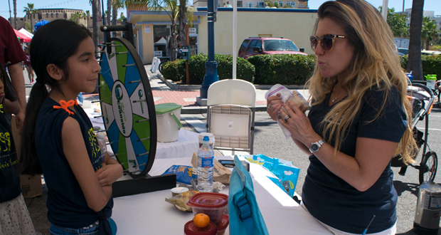 Isabel, 11 of Oceanside gets quizzed by Colleen Foster about recycleables at the Earth Fest 2016