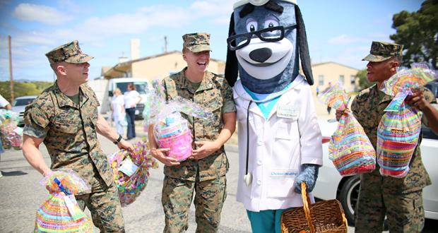 : Marines stationed at Camp Pendleton picked out Easter basket at the Armed Services YMCA where UnitedHealthcare employees donated about 700 Easter baskets today in time for Easter celebrations. The baskets were filled with snacks, treats, books, art supplies, toys and games. (Photo: Sandy Huffaker)
