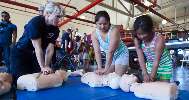 Veronica Villanueva (center) learned CPR while working at a day care center. Twice in 2013 she had to apply her knowledge to her own daughter, Caroline (right) who is now signed up to learn CPR (file photo)