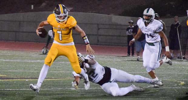 El Camino QB Jaden Casey(7) scrambles away from Jordan Duson(12)