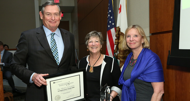 Chancellor Timothy B. White presents award to Merryl Goldberg with Rebecca D. Eisen-CSU Board Chair(courtesy photo)