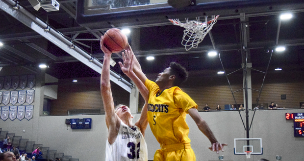 Cody Mathis(32) has his shot blocked by Jalen Flanagan(5)