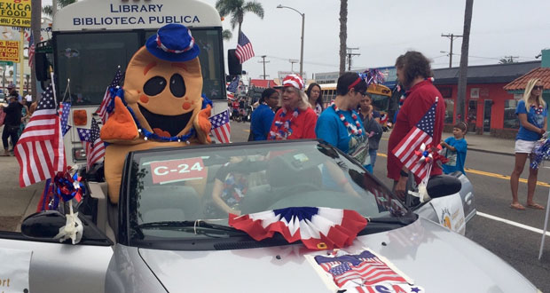 Splash and the Oceanside Public Library Bookmobile, pictured in last year's parade, will be joined by the Friends of Oceanside Public Library float “Volunteers are Heroes” in the Oceanside Independence Day Parade June 30. (courtesy photo)