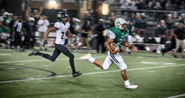 Kavika Tua sprints towards one of his four touchdowns of the night.
