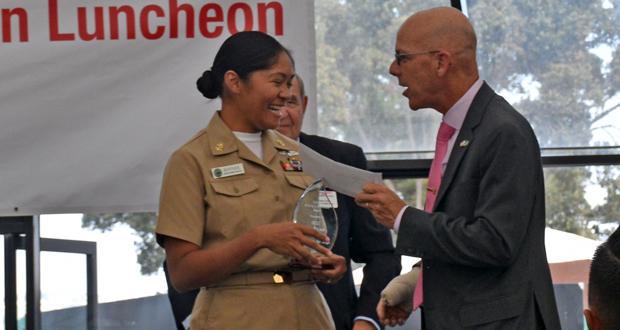 Chief Petty Officer Paz Rhyner is presented with the Fleet Week San Diego Making a Difference award by USAA Military Affairs Representative, David Dearie during the Enlisted Recognition Luncheon held at SeaWorld on Tuesday. Rhyner saved a man’s life this September when I collapsed while visiting the USS Midway Museum.  (Photo: Ed Langmaid.)