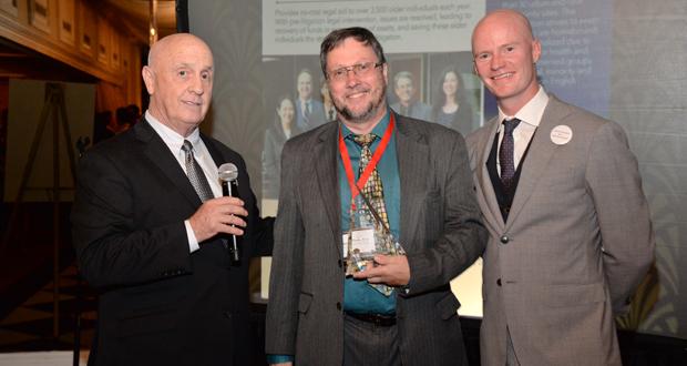  Brian Funk (center) receives the San Diego County Bar Foundation President’s Award for his leadership of the Indigent Criminal Defense Fund, presented by Bar Foundation President Neal Rockwood (left) and Board Member Brent Douglas (right). (Courtesy photo)