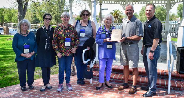 (l-r) El Camino Real Quester members Karen Bayles, Kimberly Mills, Carol Moon, Gini Murphy and chapter president, Nielsine Archibald with Oceanside Mayor Peter Weiss and Parks and Parks and Recreation Division Manager, Mark Olson.