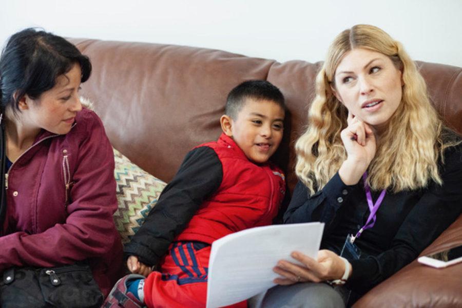 Naomi Lowe (right) works on playful speech therapy exercises with a child in Tijuana in early March as part of a ConnectMed volunteer work day. (ConnectMed photo)