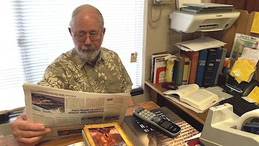 Cassidy’s Books owner Tom McDevitt works at his desk in the shop, located in San Marcos. (Escondido Grapevine photo)