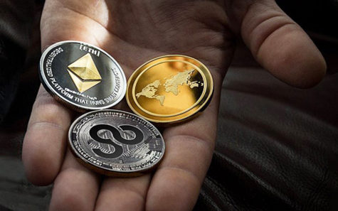 An example of AirGo Miles’ cryptocurrency (below the two other coins) is shown in a company handout. (AirGo photo)